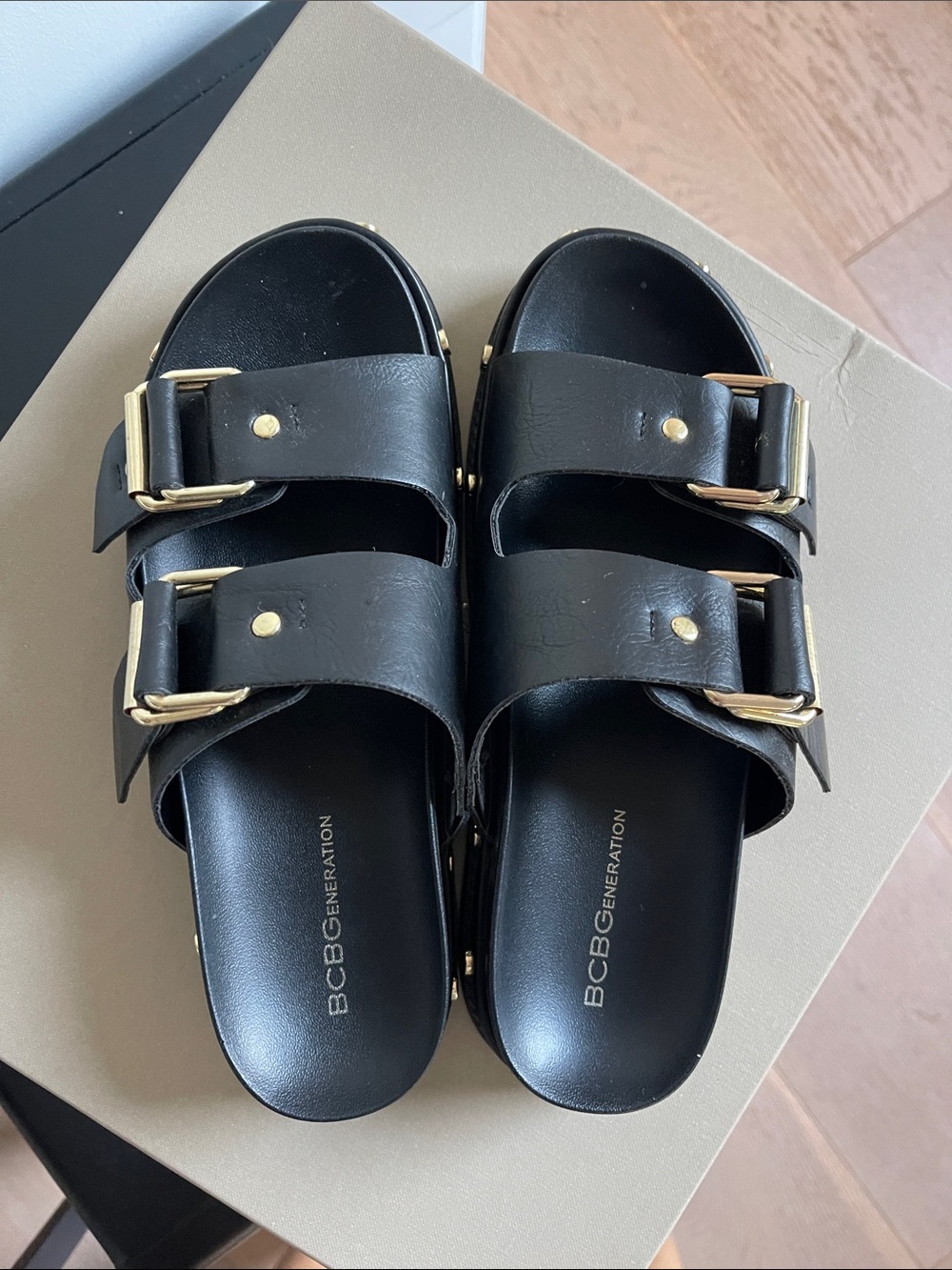 BCBGeneration Black Slide Sandals with Gold Buckles